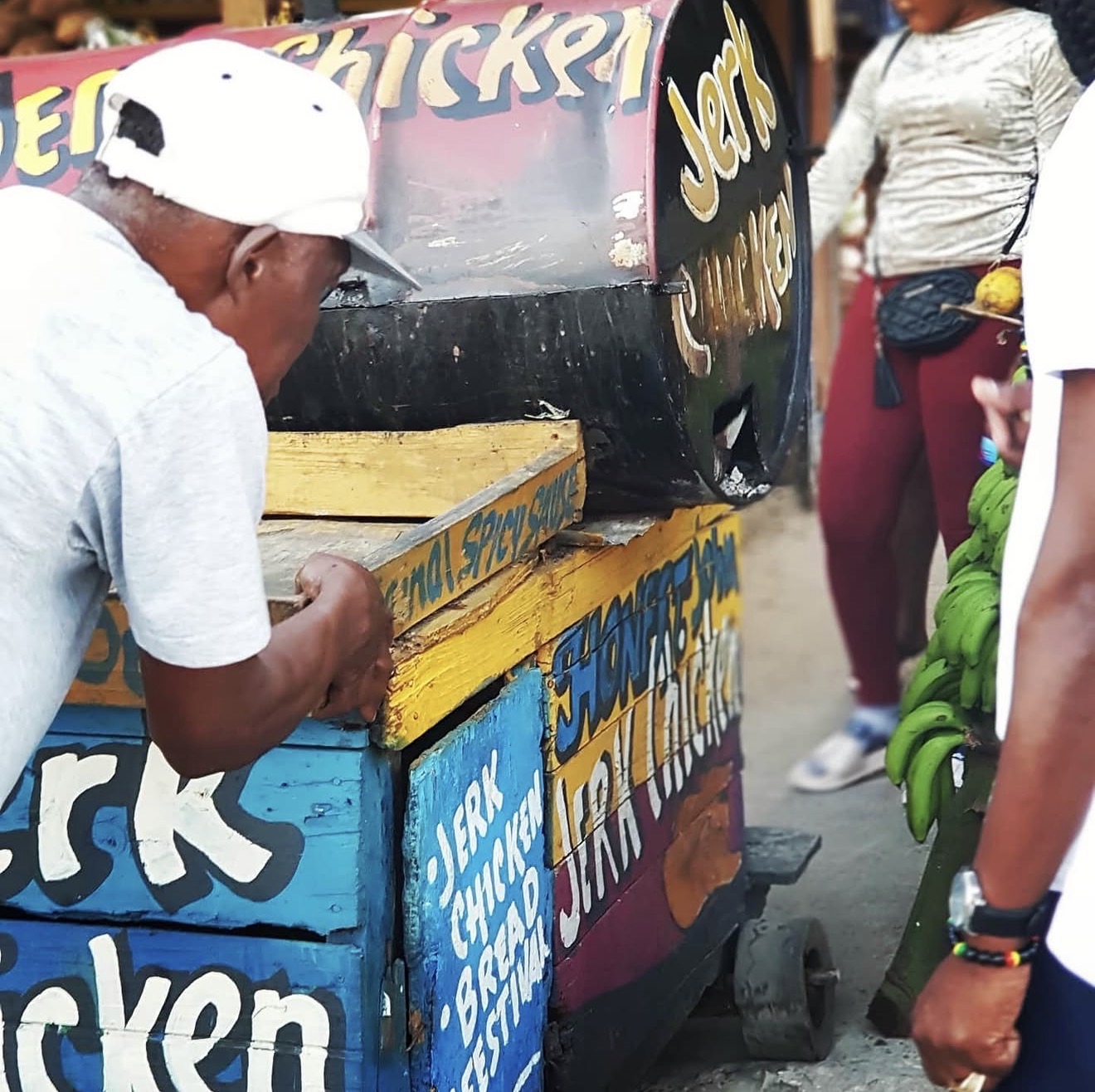 The Jerk Joint jerk pan serving street food at an outdoor event
